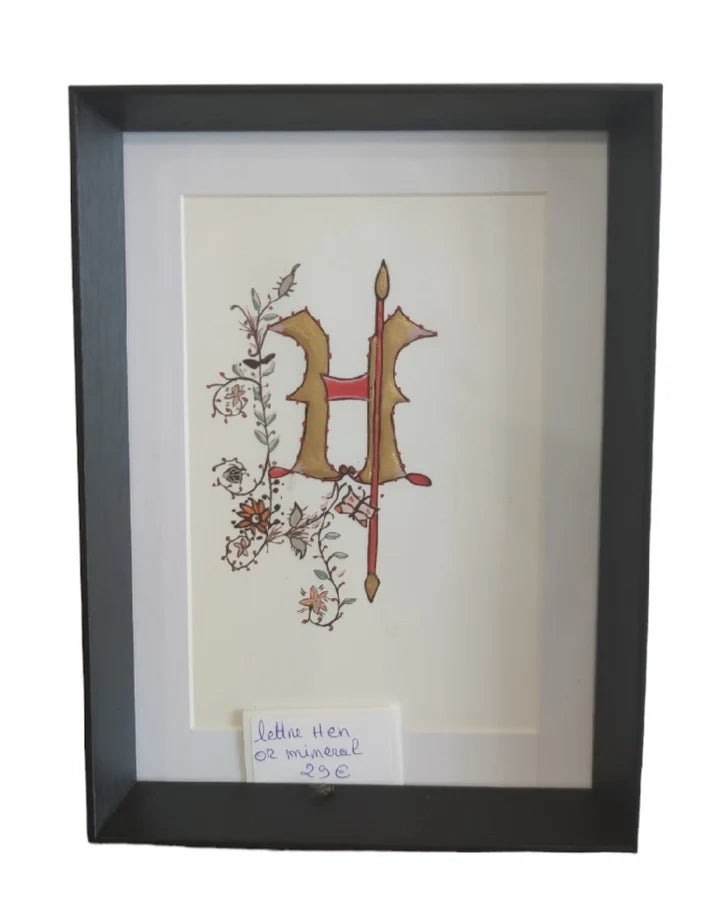 Lettre H en or minéral sur papier de haute qualité